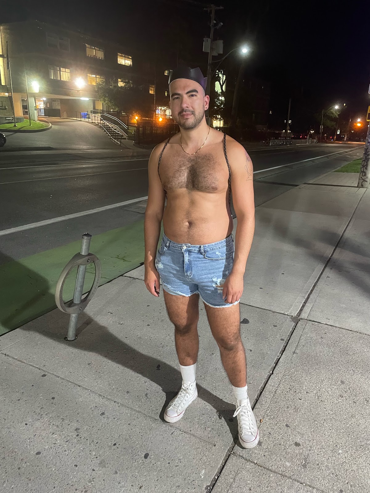 hairy muscle stud in Toronto wearing jean cut off shorts at night