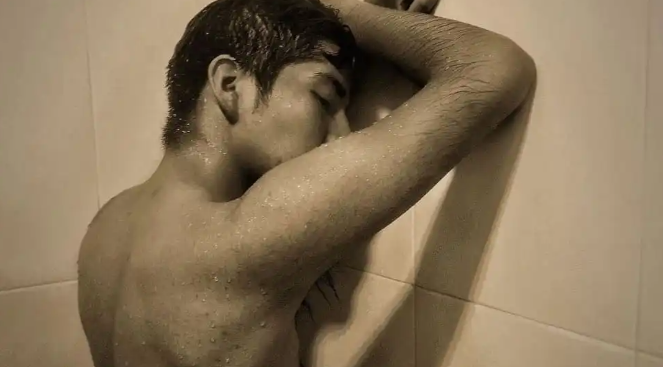 A Mexican Man Bathes In a Mexico City Gay Bathhouse via Tracey Parker and traceyparkertravel.com