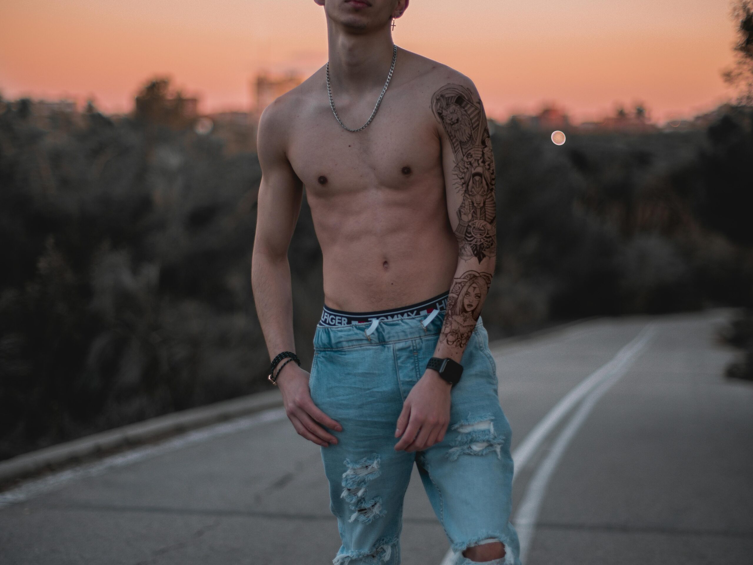gay shirtless adult porn performer standing outside giving gay adult porn industry advice Photo by Jesus Con S Silbada via Pexels