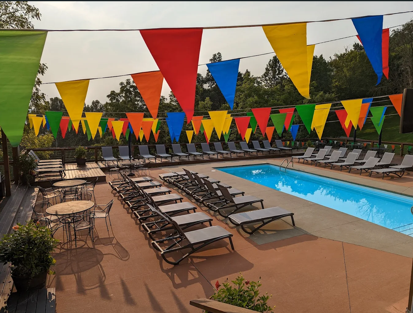 roseland gay campground where gay hookups and gay cruising occur with image of blue pool and lounge chairs in gay sex resort for men in west virginia